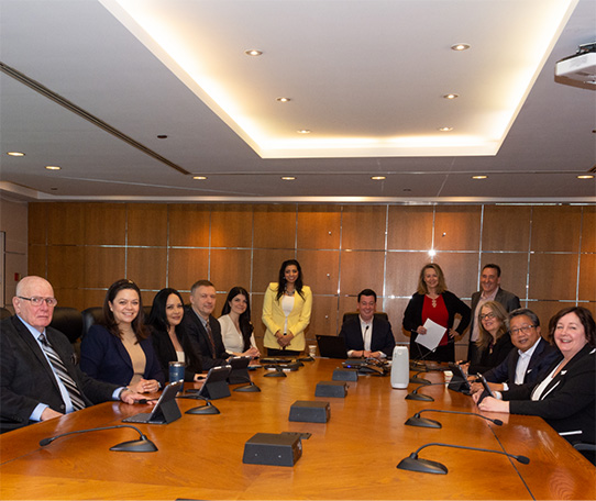 TRREB’s Board of Directors around a board room table.